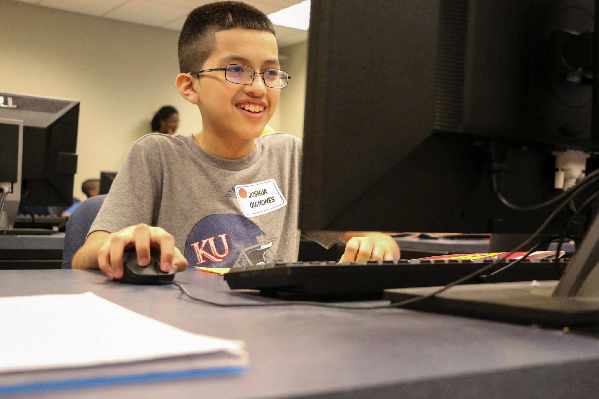 A young male student working on a computer