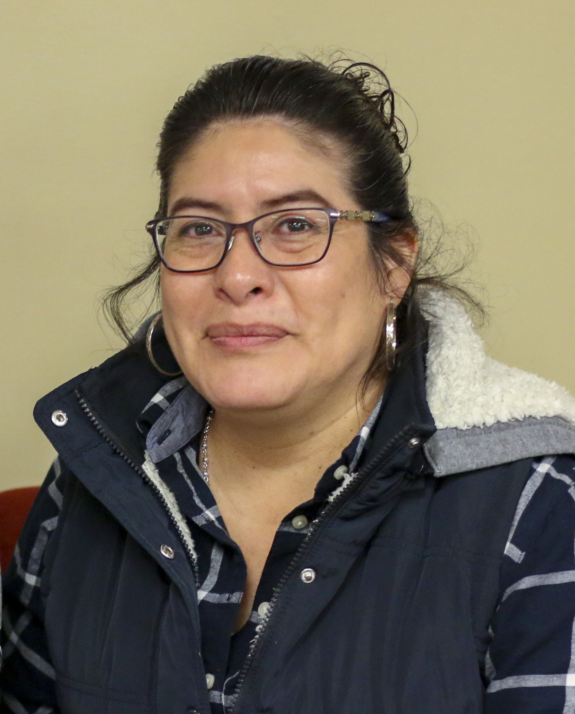 A photograph of Maria Medina, a Latina mother